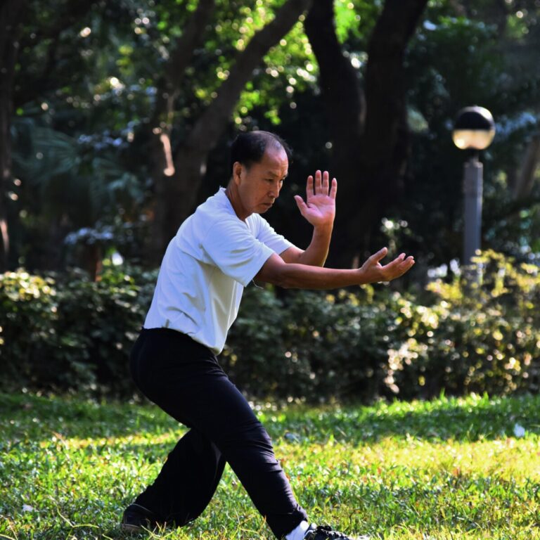 Man doing Tai Chi in a park to symbolise the growth mindset practices